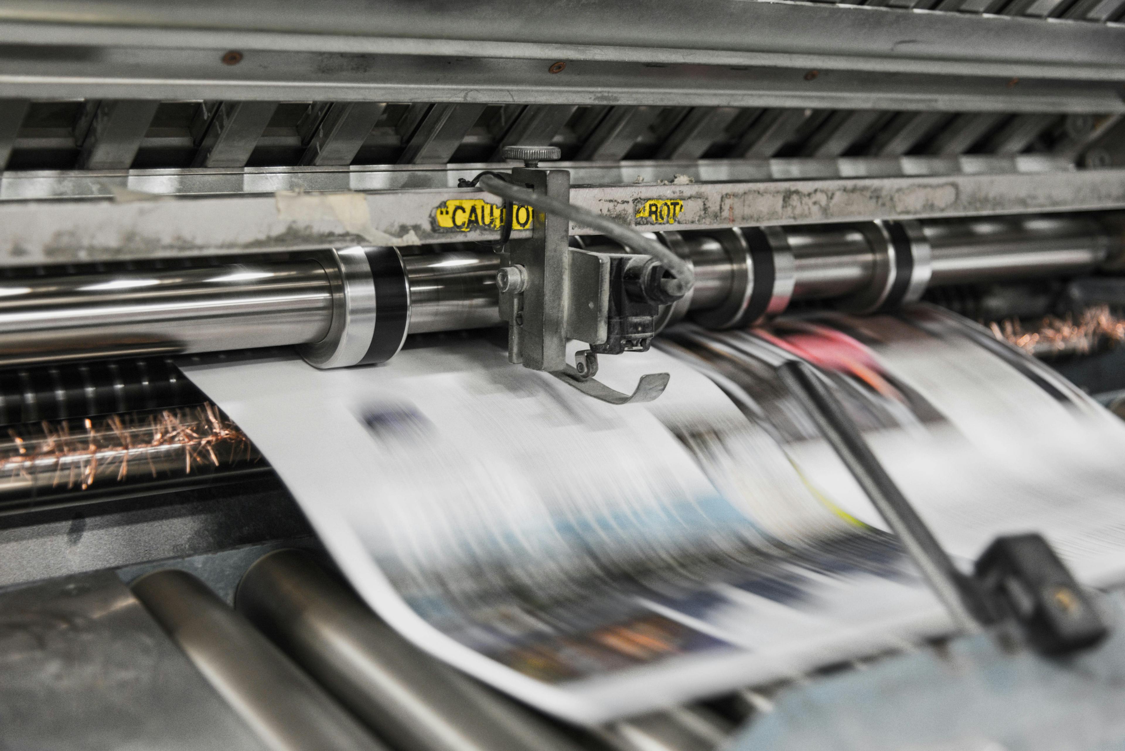 A printer printing newspapers